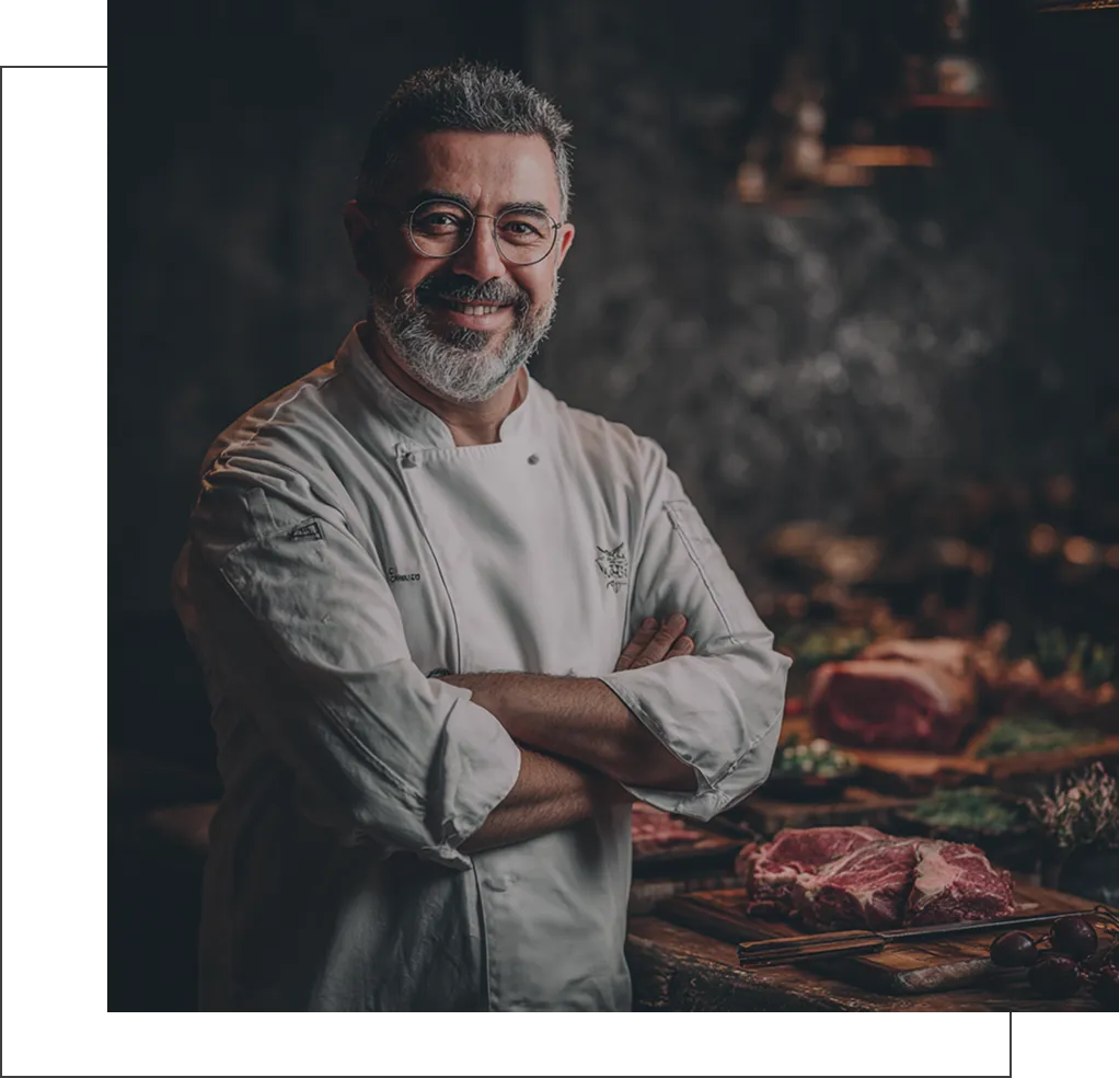 Head chef standing inside the restaurant kitchen