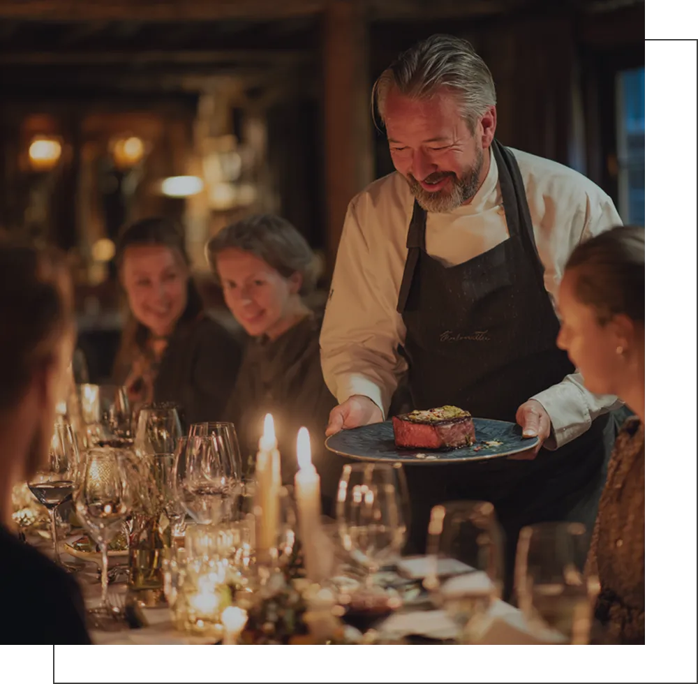 Restaurant server presenting a meal to guests